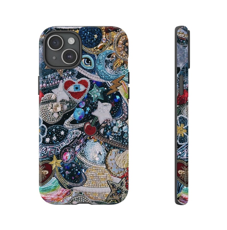 May include: A colourful phone case featuring a variety of embellishments, including stars, hearts, and planets. The case is made from a clear material and has a black border.
