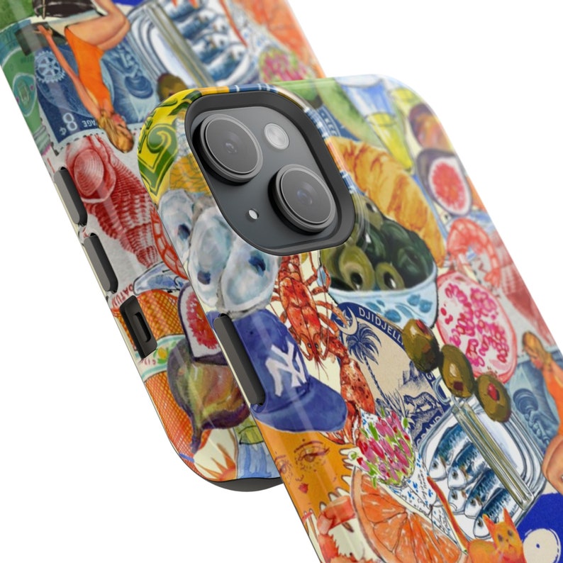 May include: A colorful phone case with a collage of images, including a lobster, olives, a fig, a lemon, and a baseball cap. The case is designed for a phone with a camera bump.