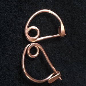 Pair of Small Roman brooches (3/4” -1”long each). Pair of Bow Fibulae.