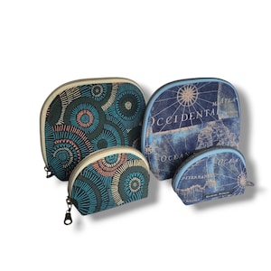 May include: Four different sized zippered pouches. The largest pouch is blue with a vintage map design and the text "OCCIDENTAL" printed on it. The other three pouches are green with a circular pattern.