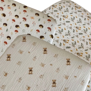 Organic muslin cotton fitted sheets for Nestig Wave, Cloud, Snow, Palm, and Full Cribs.