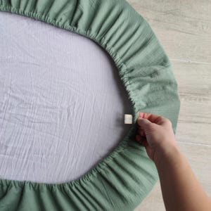 Organic cotton fitted sheets for Sleepi V2, V3, Junior, Mini, and Snoozi Bassinet. Custom-tailored design, breathable and soft, ensuring baby comfort while being eco-friendly.