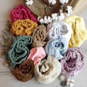 Organic muslin cotton fitted sheets for Nestig Wave, Cloud, Snow, Palm, and Full Cribs.