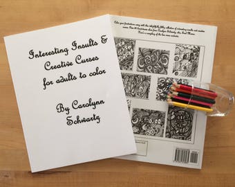 May include: A white cover with black text that reads "Interesting Insults & Creative Curses for adults to color" and "By Carolynn Schwartz". The cover is on top of a coloring book with black and white illustrations of various phrases and designs. The coloring book has a black and white barcode on the back.