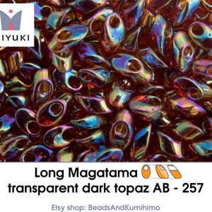 transparent dark topaz AB - 257 - Long Magatama (10 gram)