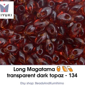 transparent dark topaz - 134 - Long Magatama (10 gram)