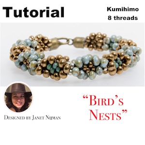 May include: A close-up of a beaded bracelet with a brown and blue color scheme. The bracelet is made using the Kumihimo technique with 8 threads. The bracelet is called "Bird's Nests" and is designed by Janet Nijman.