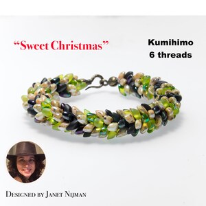 May include: A green, black, and white beaded bracelet with a silver clasp. The bracelet is made with 6 threads and is called "Sweet Christmas".