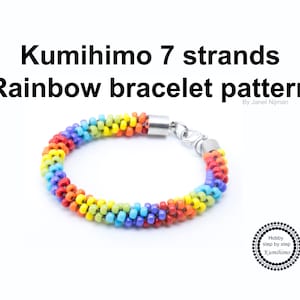 May include: Rainbow coloured Kumihimo bracelet pattern with 7 strands. The bracelet is made with small beads and has a silver clasp. The text "Kumihimo 7 strands Rainbow bracelet pattern By Janet Nijman" is visible in the image.