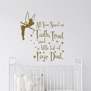 May include: A white cot with a brown and white rocking horse in front of it. The wall behind the cot has a brown vinyl decal of Tinkerbell with the quote "All You Need is Faith, Trust and a little bit of Pixie Dust."