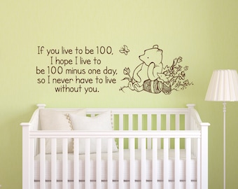 May include: A Winnie the Pooh nursery wall decal featuring Pooh Bear and Piglet sitting on a log with a quote that reads: "If you live to be 100, I hope I live to be 100 minus one day, so I never have to live without you."