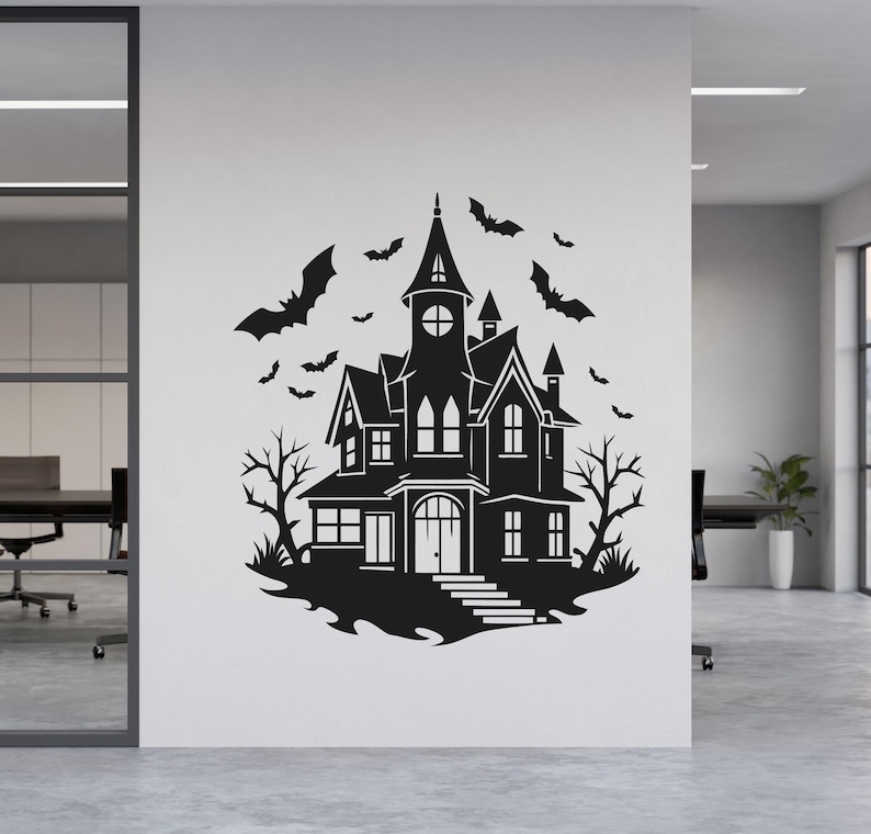 May include: Black silhouette of a haunted house with bats flying around it. The house has multiple windows, a tall tower, and a front door with steps. Bare trees and a curved base complete the spooky scene.