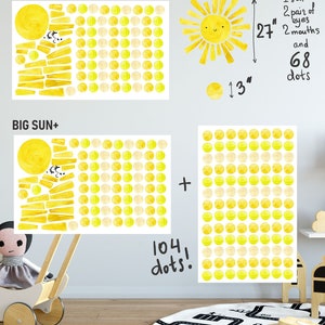 May include: A set of two watercolor sun wall decals. The larger decal is made up of 104 yellow and cream dots and a sun with rays. The smaller decal is made up of 68 yellow and cream dots and a sun with rays. The text "BIG SUN" and "BIG SUN+ " is written on the decals. The text "104 dots!" is written below the larger decal. The text "1 sun, 2 pairs of eyes, 2 mouths and 68 dots" is written next to the smaller decal. The text "27" and "13" are written next to the decals to indicate the size in inches.