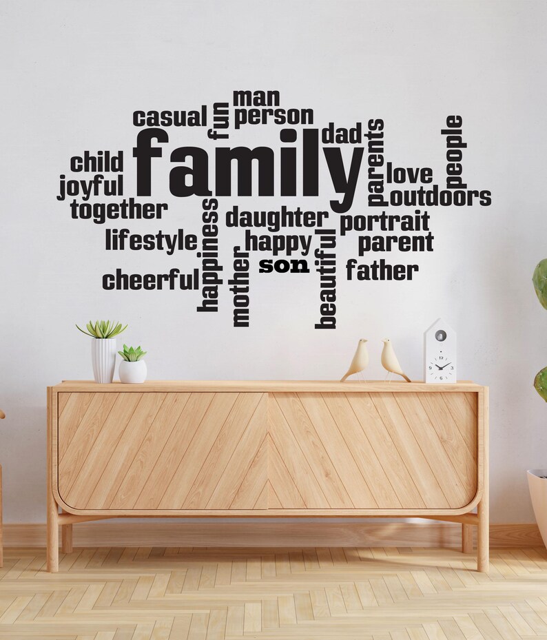 May include: Black and white word art decal with the word "family" in the center and surrounded by words like "love", "joyful", "happy", "son", "daughter", "father", "mother", "casual", "fun", "people", "outdoors", "portrait", "lifestyle", "cheerful", "man", "person", "dad", "parents".