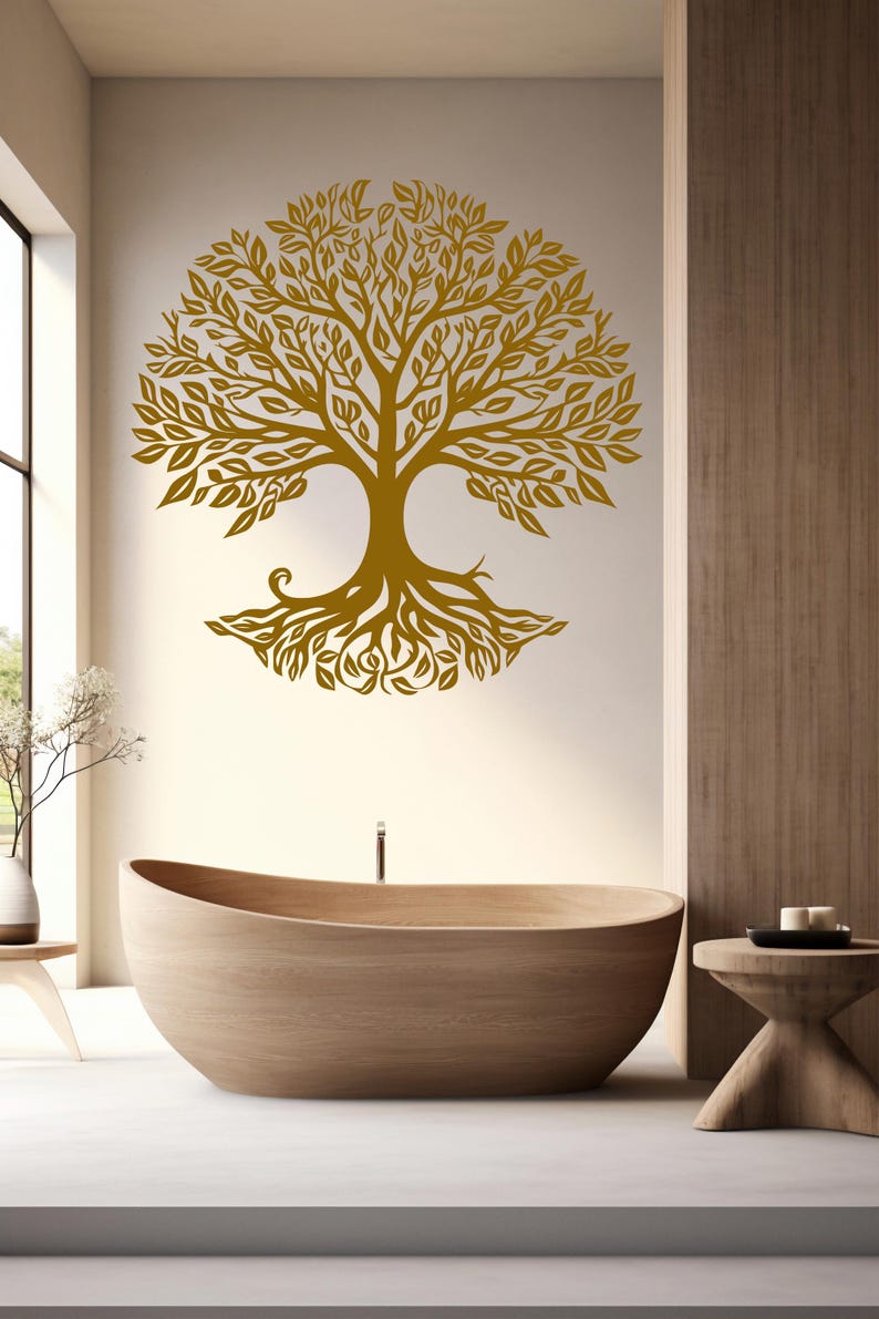 May include: A gold tree of life wall decal with intricate branches and roots, displayed in a bathroom with a wooden bathtub and a wooden stool.