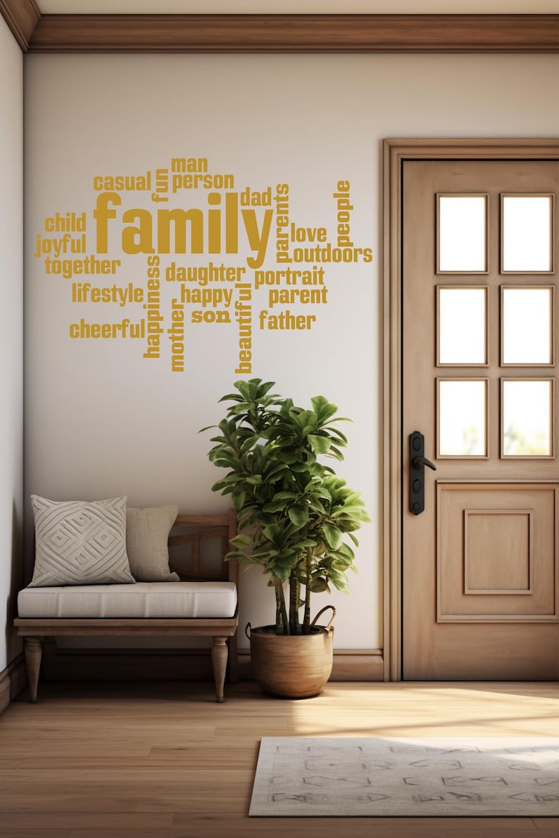 May include: A gold vinyl wall decal with the word "family" in large letters surrounded by smaller words like "love", "joyful", "happy", "together", "parents", "daughter", "son", "father", "mother", "casual", "person", "lifestyle", "cheerful", "beautiful", "portrait", "outdoors", "people", "man", "dad", "fun", "child", "parent".