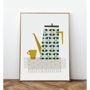 May include: A gold framed print of a green and white patterned coffee pot with a yellow spout and a small orange cup on a beige patterned tablecloth.
