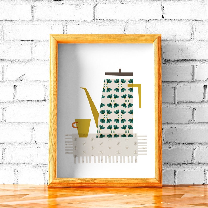 May include: A framed print of a stylised illustration of a coffee pot with a green and white patterned design, a yellow cup, and a white and grey patterned tablecloth.