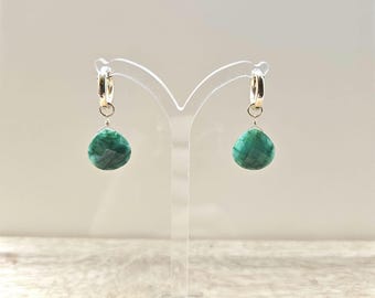 Emerald earrings hanging from huggie Gold filled hoops