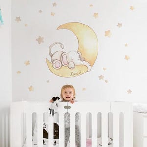 Hand-painted effect children&#39;s vinyl of an elephant on the moon with stars. Nursery wall decals for babies, children&#39;s wall stickers