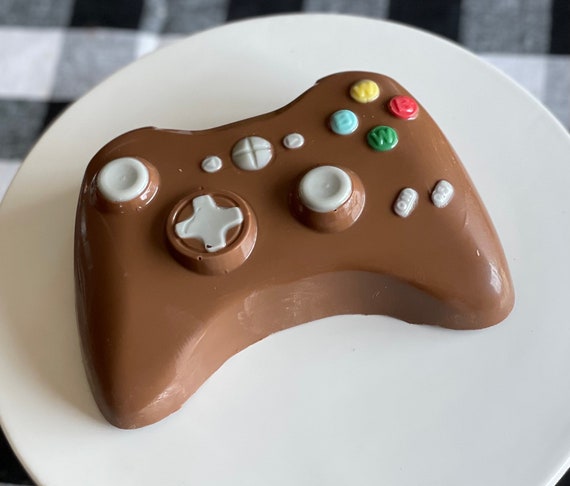 XBox and Wii chocolate cake with raspberry filling and almond cake. Wii and  XBox remote control suga…