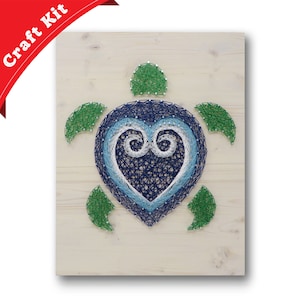 May include: A string art craft kit featuring a blue, white, and green turtle with a heart design. The turtle is made of string wrapped around nails hammered into a wooden board.