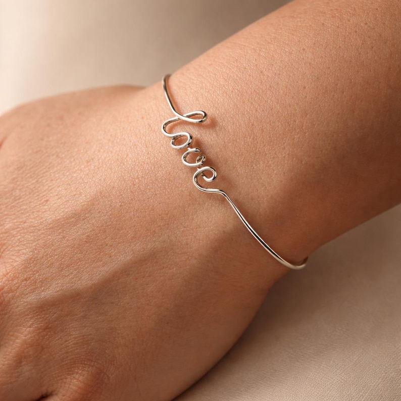 personalized wire name bracelet on wrist minimalist handmade jewelry