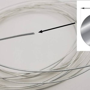 May include: A coil of silver wire, 1.0 mm in diameter. The wire is coiled and ready for use in jewelry making or other crafts.