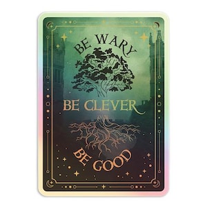 May include: A rectangular sticker with a holographic border. The sticker features a green and black background with the words "BE WARY, BE CLEVER, BE GOOD" in a stylized font. A tree and its roots are also depicted.