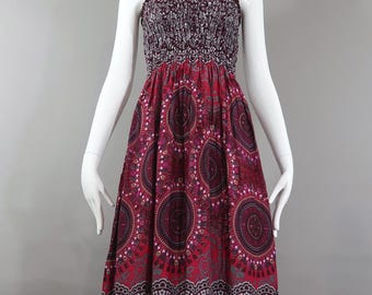 Vestido largo hecho a mano: estampado floral exótico, busto fruncido, bajo con volantes, rayón vaporoso.