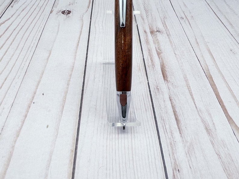 Close-up view of 2mm mechanical pencil made in black walnut wood - of the barrel and chrome tip