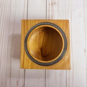 Osage Orange wooden bowl with square top and round opening and bowl - top view looking into the bowl