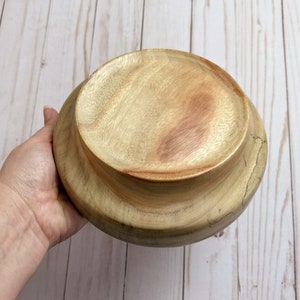 Camphor bowl with wide opening and narrower base - bottom view of the wooden bowl