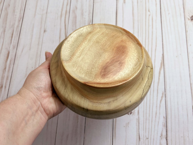 Camphor bowl with wide opening and narrower base - bottom view of the wooden bowl