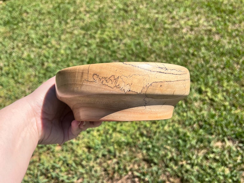 Camphor bowl with wide opening and narrower base - side view in natural light