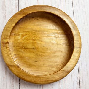 Shallow bowl made of Cypress wood - top down view