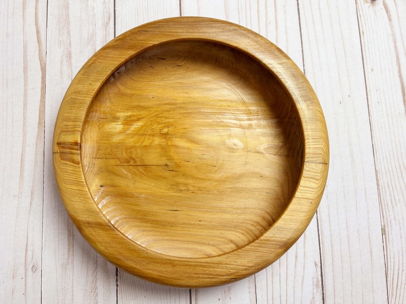 Shallow bowl made of Cypress wood - top down view