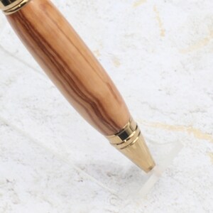 Close-up of pen tip for Titanium Gold Cigar Pen made with olive wood and gold hardware