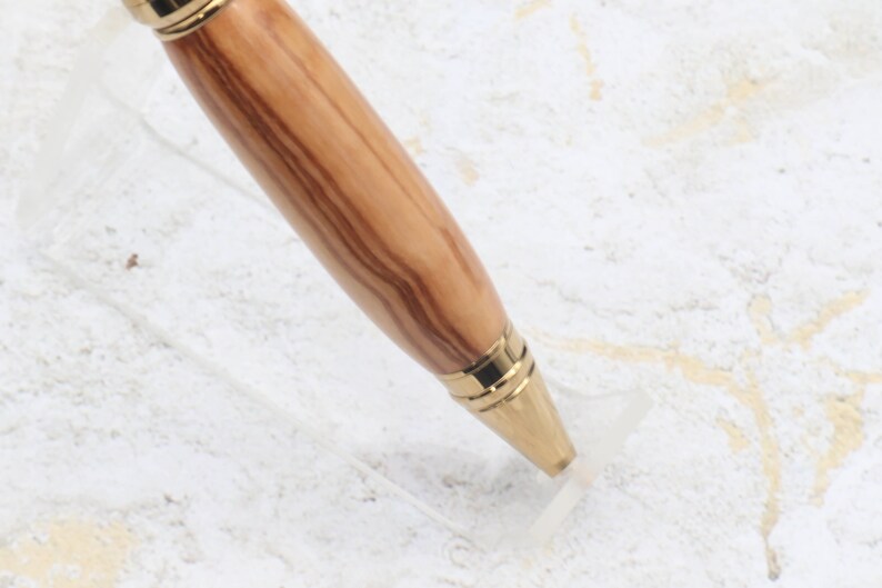 Close-up of pen tip for Titanium Gold Cigar Pen made with olive wood and gold hardware