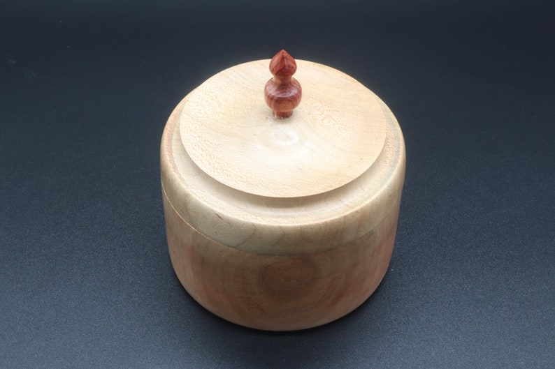 Wooden bowl made of maple and tulipwood with lid.