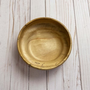 Camphor bowl with wide opening and narrower base - top down view of wooden bowl