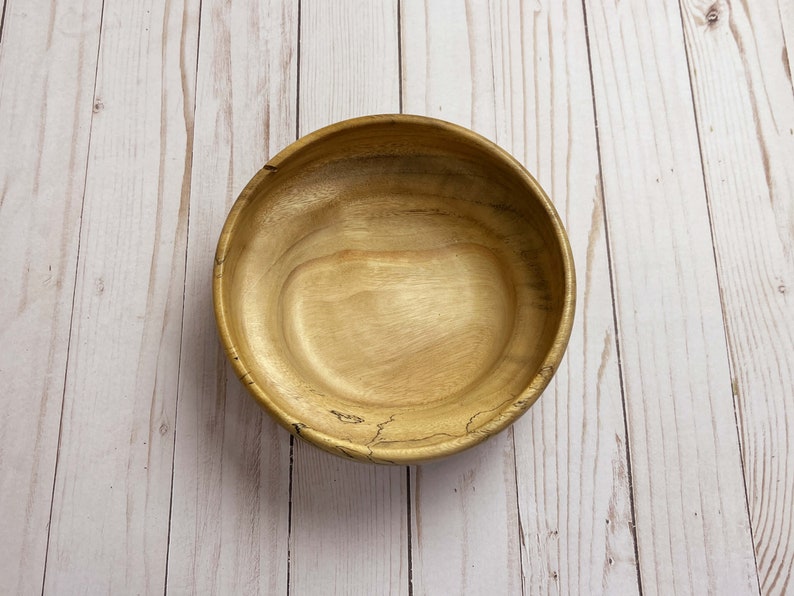 Camphor bowl with wide opening and narrower base - top down view of wooden bowl