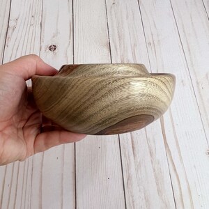 Camphor wood bowl - being held, to show side view