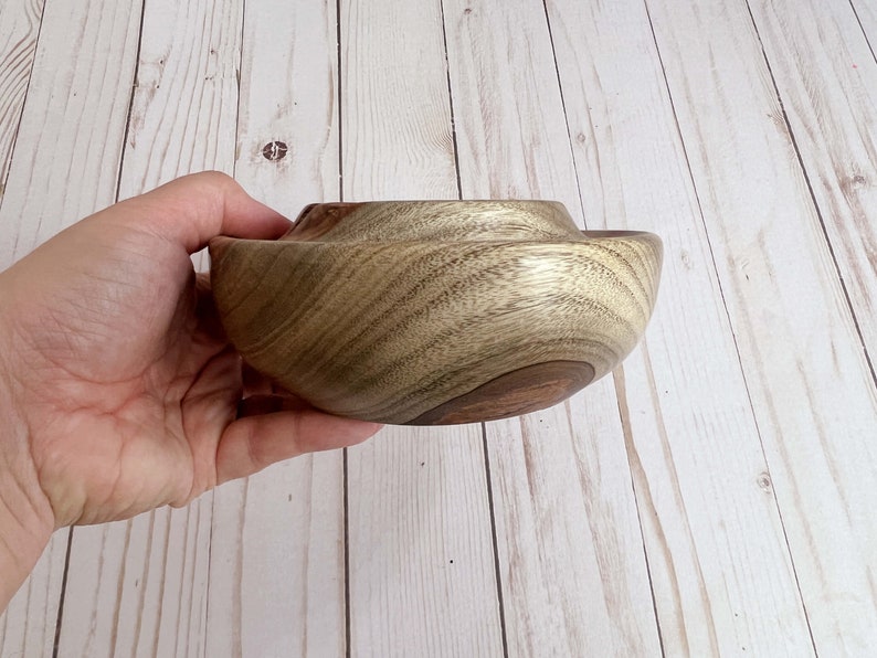 Camphor wood bowl - being held, to show side view