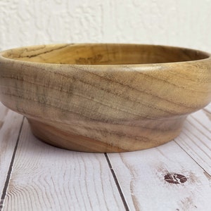 Camphor bowl with wide opening and narrower base - side view of wooden bowl