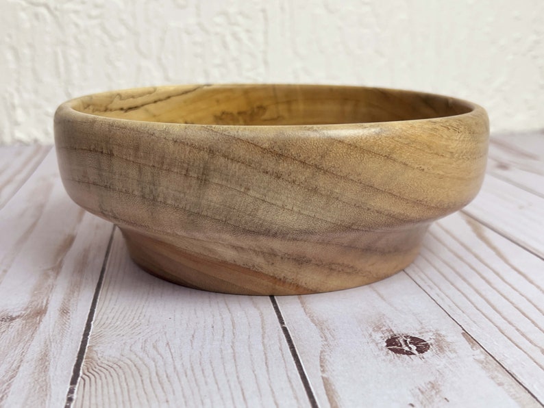 Camphor bowl with wide opening and narrower base - side view of wooden bowl
