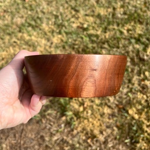 Indian Rosewood wooden bowl outside in natural light - showing side of the bowl