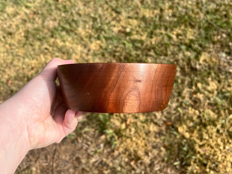 Indian Rosewood wooden bowl outside in natural light - showing side of the bowl