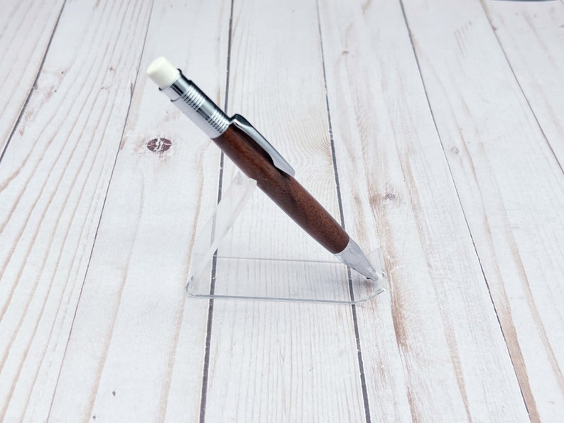 Full view of 2mm mechanical pencil made in black walnut wood - from the side - in a pencil holder.