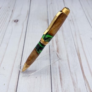 Side view of olive wood and resin twist pen with satin gold hardware